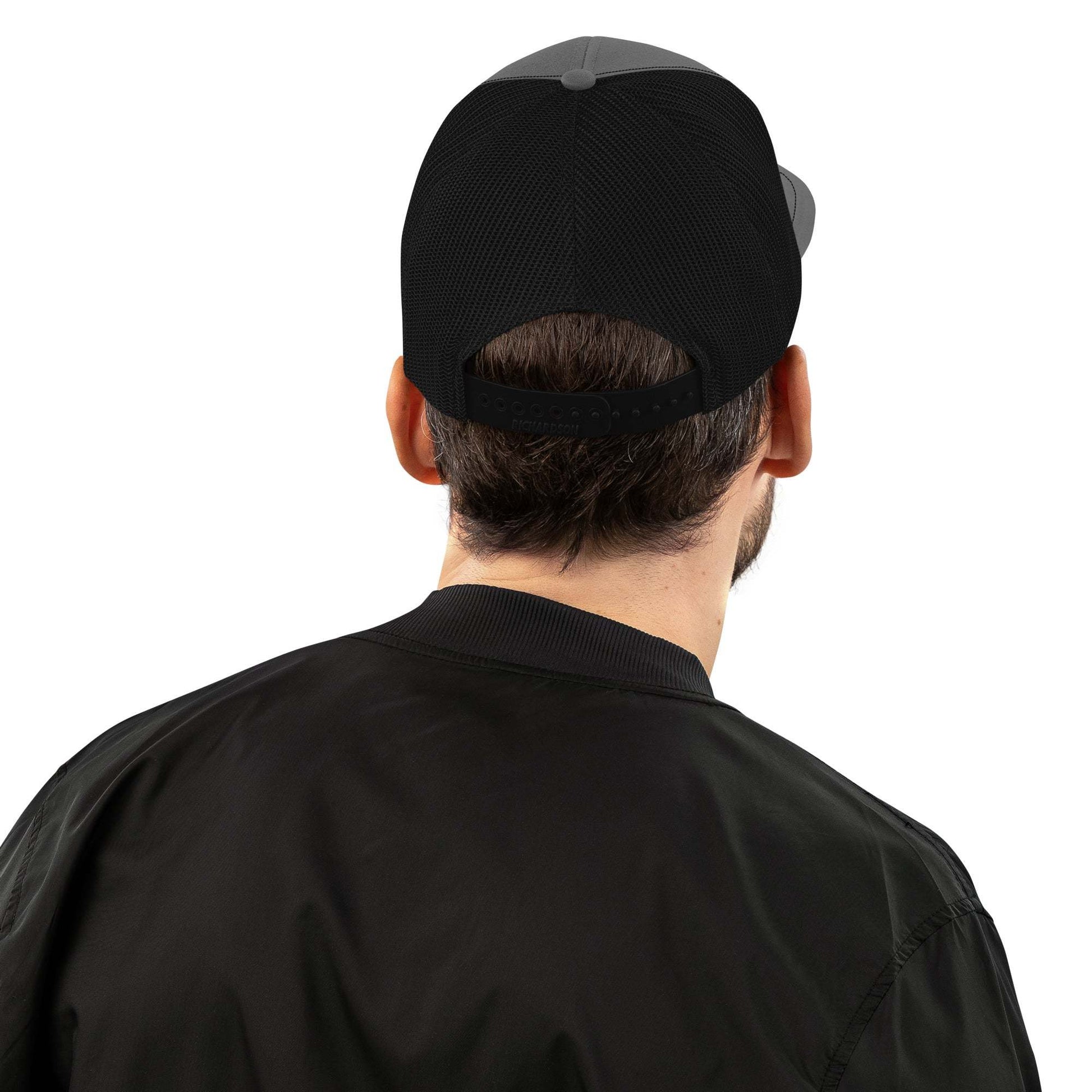 Man wearing the Savage Squad Snapback with adjustable plastic snapback and polyester mesh back.