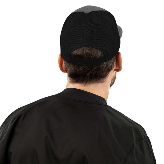 Man wearing the Savage Squad Snapback with adjustable plastic snapback and polyester mesh back.